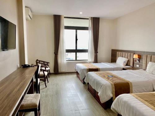 Postel nebo postele na pokoji v ubytování Da Huong Hotel