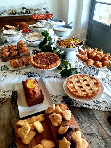 a table topped with lots of different types of food at Masseria Le Torri in Polignano a Mare
