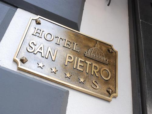 a hotel san pietro sign on a wall at Hotel San Pietro in Naples