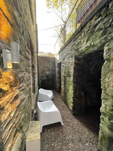 a group of toilets in a brick wall at Dunoon River Clyde Flat in Innellan