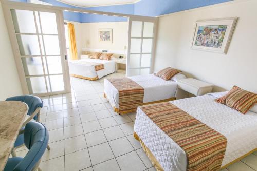 Кровать или кровати в номере Praia Brava Hotel