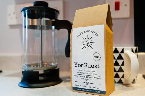 a box sitting on a counter next to a blender at BOOTique House - Luxury Group Accommodation in Wakefield in Wakefield
