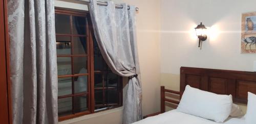 Ένα ή περισσότερα κρεβάτια σε δωμάτιο στο Lani's Guest House - No Loadshedding