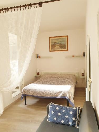 a bedroom with a bed and a window at CA del CARMINE in Florence