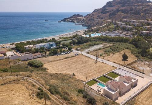 an aerial view of a beach and the ocean at Mythos villas in Damnoni