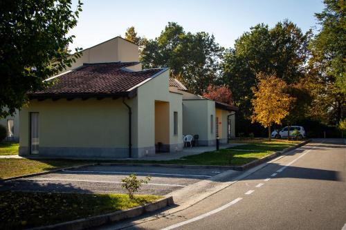 a house on the side of a street at Albavillage Hotel Wellness & Camping in Alba