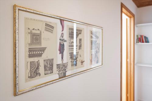 a picture hanging on a wall in a room at Casa Alina- Art House in Foligno