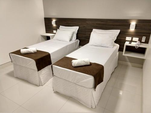 Кровать или кровати в номере Pousada Jucazinho
