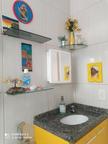 a bathroom with a sink and a counter top at Verona in Paulista