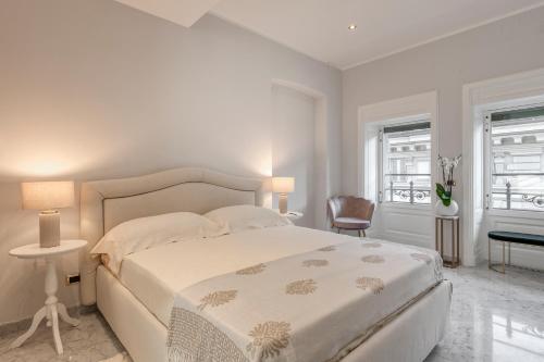 מיטה או מיטות בחדר ב-Imperiale Suites Milano