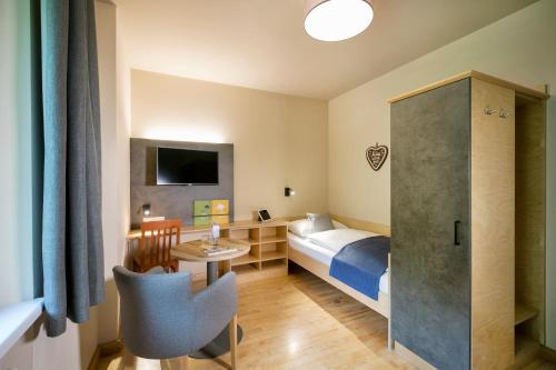 Postel nebo postele na pokoji v ubytování JUFA Hotel Mariazell