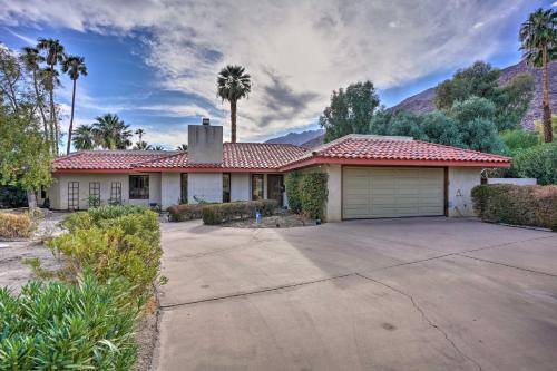 a house with a garage and palm trees at Borrego Springs Getaway with Private Pool and Views! in Borrego Springs