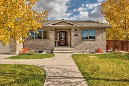 a brick house with a brown door and a sidewalk at Outdoor Enthusiasts Retreat with Hot Tub, Deck in Lander
