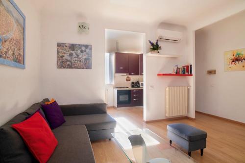 a living room with a couch and a chair at Apartment Palazzuolo in Florence