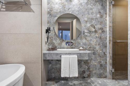 a bathroom with a sink and a mirror at Melas Hotel Istanbul in Istanbul