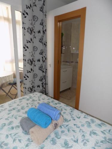 Säng eller sängar i ett rum på Málaga Centro habitaciones privada en apartamento compartidos