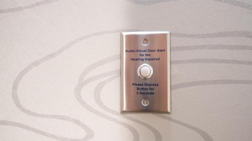 a lightswitch on a wall withbestosbestosresentresent back part for the floor at Holiday Inn & Suites Philadelphia W - Drexel Hill by IHG in Drexel Hill