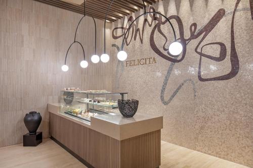 a restaurant with a counter with a display of food at Melas Hotel Istanbul in Istanbul