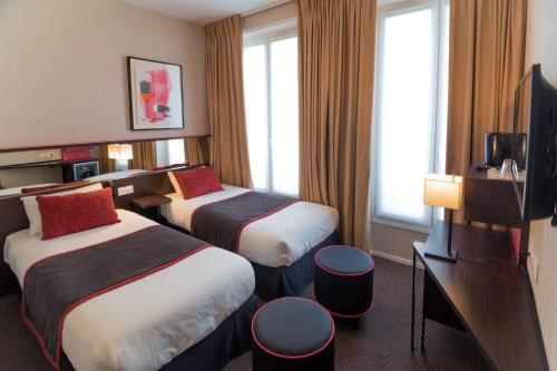 Katil atau katil-katil dalam bilik di Hôtel Charing Cross