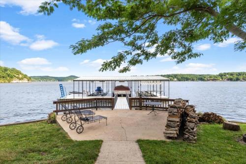 a dock on a lake with a gazebo at Private Dock Spacious Lakefront Home in Stover in Laurie