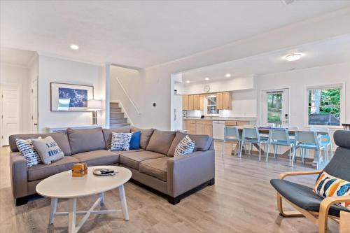 a living room with a couch and a table at Private Dock Spacious Lakefront Home in Stover in Laurie