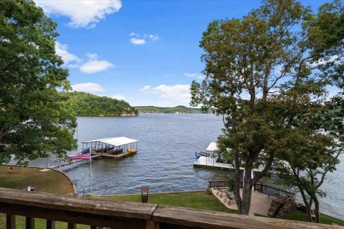 a dock with a boat on a lake at Private Dock Spacious Lakefront Home in Stover in Laurie