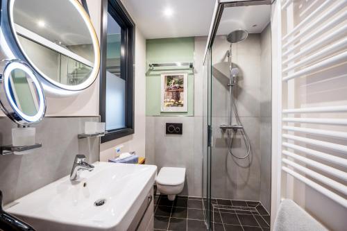a bathroom with a sink and a shower at Domizil Apartment in Naumburg