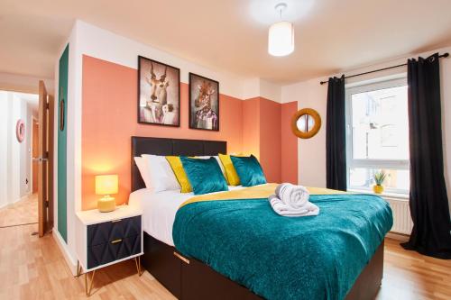 a bedroom with a large bed and a window at The Sleek Nottingham Gem with Balcony - Sleeps 6 in Nottingham