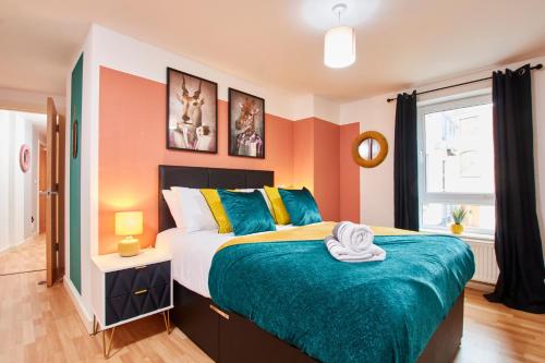 a bedroom with a large bed and a window at The Stunning Nottingham Gem with Balcony in Nottingham