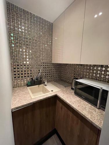 Kuchyňa alebo kuchynka v ubytovaní Apartament ONE ogródek i parking