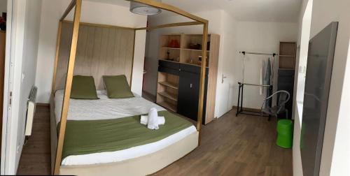 a bedroom with a bed with a large mirror at CASARIOU Les Bernards Villa Grande bâtisse 12p avec cheminée bain nordique billiard piscine in Vaudevant