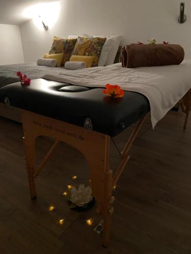 a bed with lights on it in a room at CASARIOU Les Bernards Villa Grande bâtisse 12p avec cheminée bain nordique billiard piscine in Vaudevant