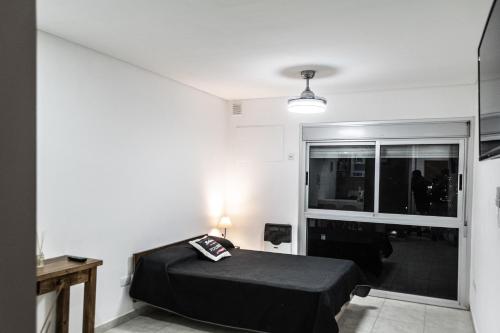 Giường trong phòng chung tại Bahia Rental-Depto con cochera opcional