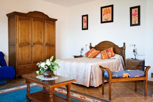 سرير أو أسرّة في غرفة في LA VESANILLA