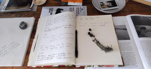 an open book with a pen on the pages at La collina sui trabocchi in Ortona