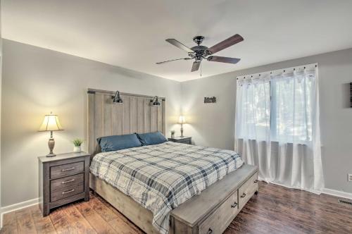 a bedroom with a bed and a ceiling fan at Massanutten Getaway with Fireplace Hike and Ski! in McGaheysville