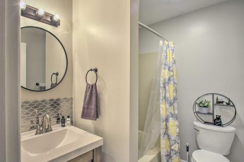 a bathroom with a sink and a toilet and a mirror at Massanutten Getaway with Fireplace Hike and Ski! in McGaheysville