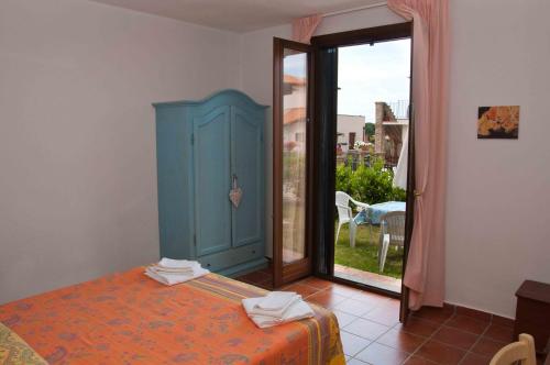 Postel nebo postele na pokoji v ubytování Borgo Valmarina