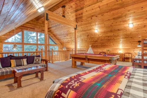a log cabin with a pool table in a room at Blue Pine Chalet in Government Camp