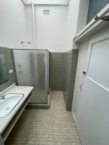 a bathroom with a shower and a sink at Royal Hotel Motel Scone in Scone