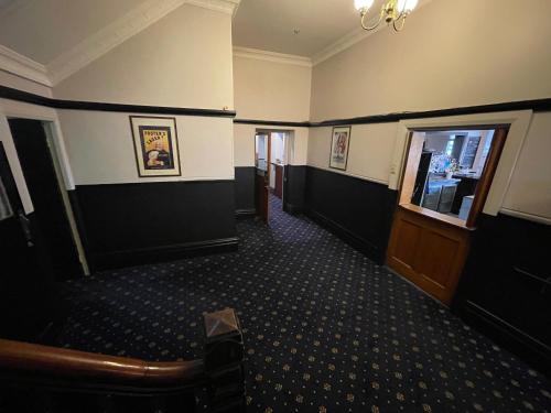 a hallway of a building with a waiting room at Royal Hotel Motel Scone in Scone