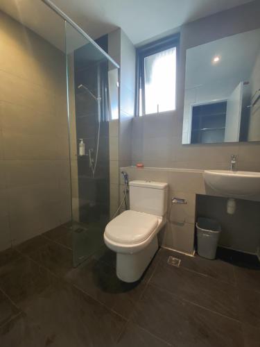 a bathroom with a toilet and a sink at Maison life 小居屋 The Loft Imago in Kota Kinabalu