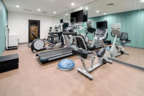 a gym with several treadmills and cardio machines at Holiday Inn Express Hotel & Suites Atascadero by IHG in Atascadero