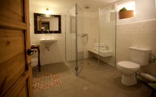 a bathroom with a shower and a toilet and a sink at The Nest - A Romantic Vacation Home in Ein Kerem - Jerusalem in Jerusalem