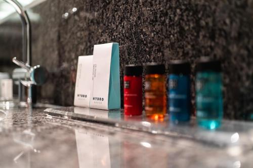 a group of bottles sitting on top of a counter at Onderwijshotel De Rooi Pannen Eindhoven in Eindhoven