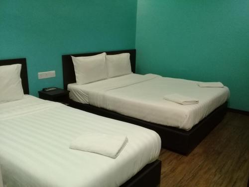 Clover Hotel Ipohにあるベッド