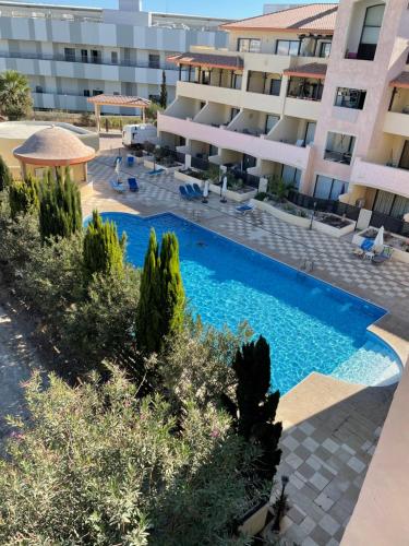 an image of a swimming pool in front of a building at 109 Queens Gardens, Paphos in Paphos City