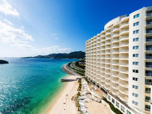 a view of a hotel and the beach at Hotel Resonex Nago in Nago