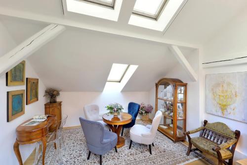 a living room with a table and chairs at Kalina Apartments in Brno