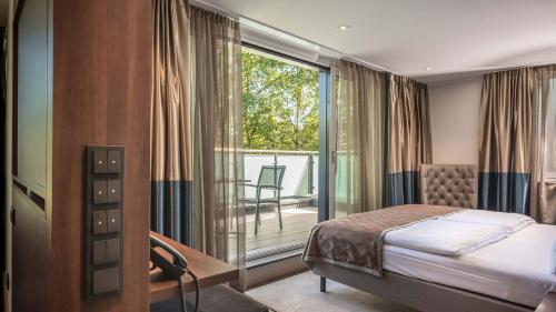 Postel nebo postele na pokoji v ubytování Innspire Hotel